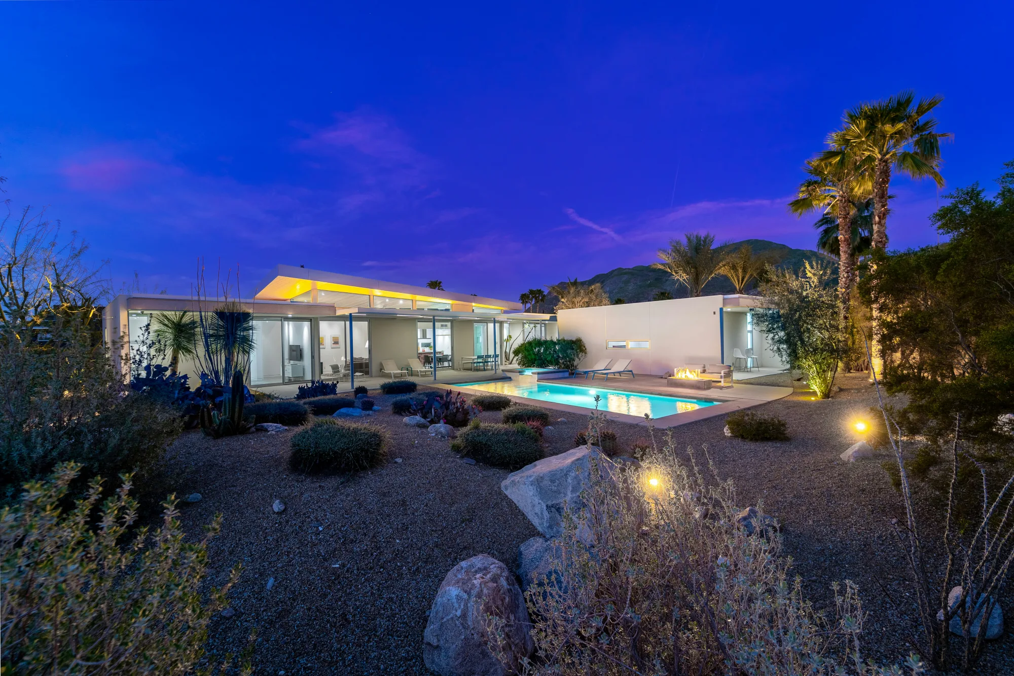 Pool at twilight with rocky landscape